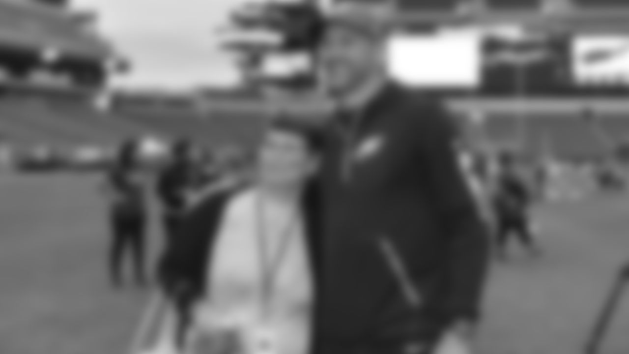 Offensive coordinator Mike Groh happily posing for a photo with a fan
