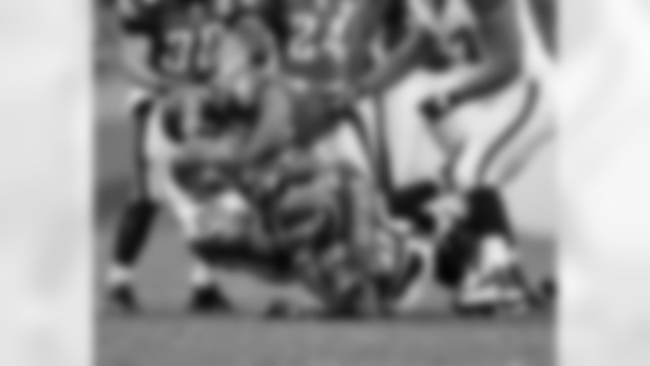 The Eagles defense applies the muscle to bring down RB Maurice Morris
