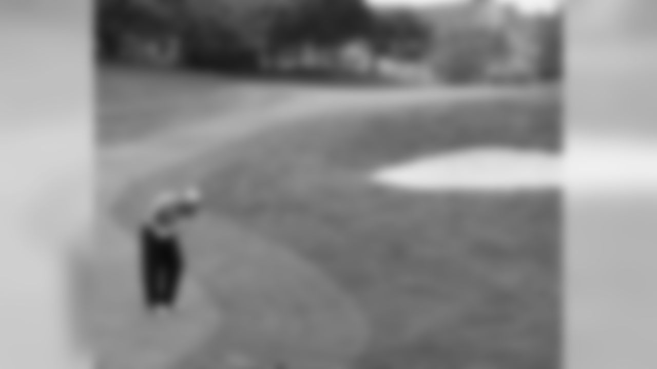 Following a great drive, Herremans chips it on the green