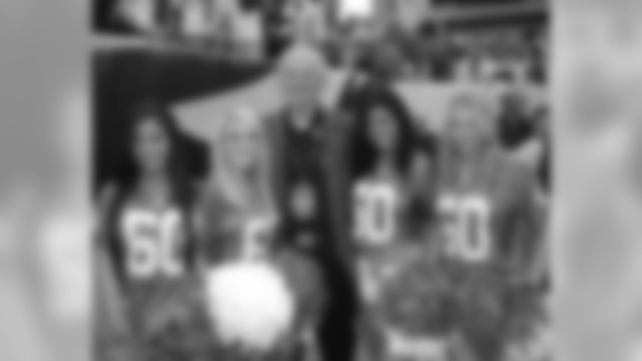 Alicia, Dani, Stephanie and Laura pose for a picture with legendary player Chuck Bednarik