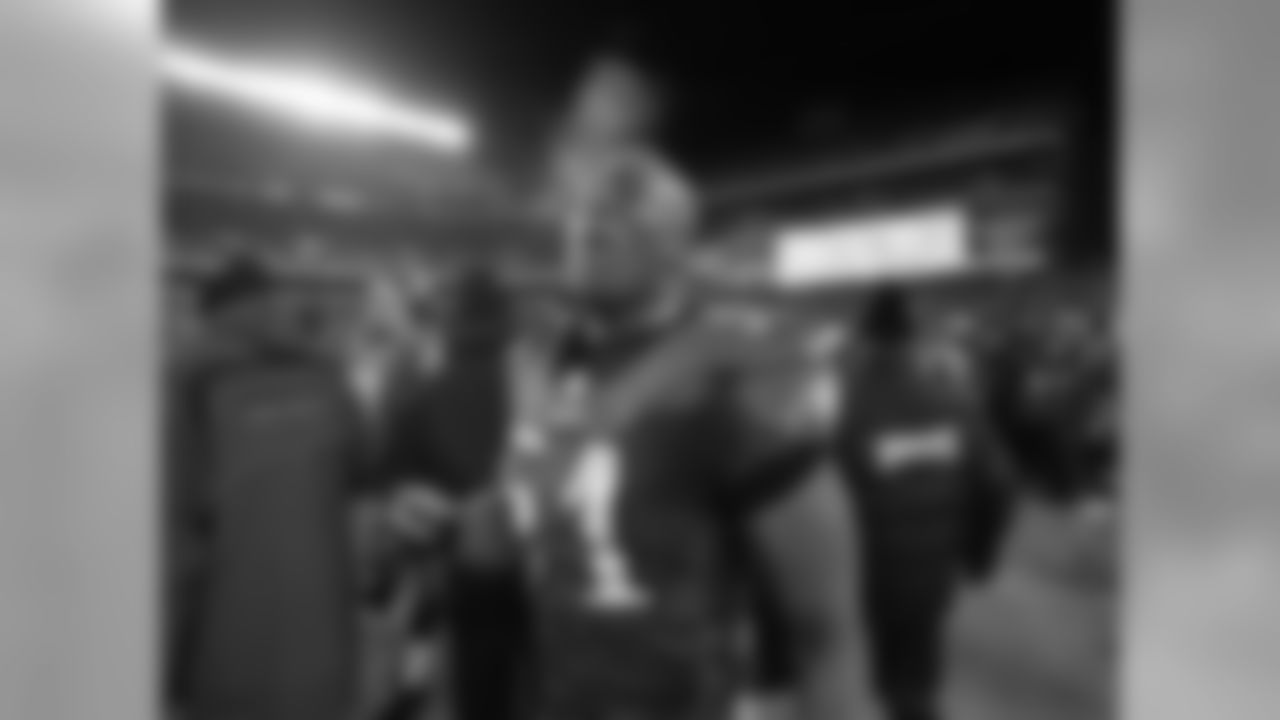 Linebacker Nate Wayne basks in the Eagles' victory on a chilly winter evening.