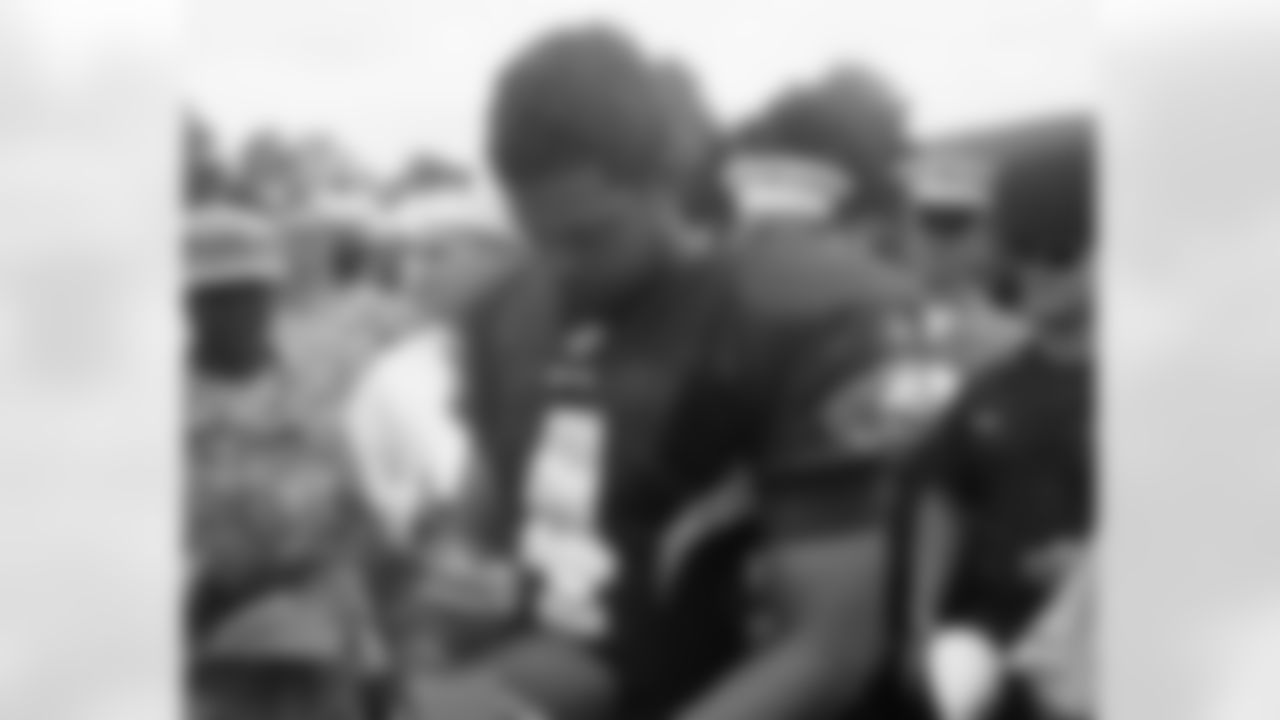 QB Kevin Kolb signs autographs for members of the U.S. military