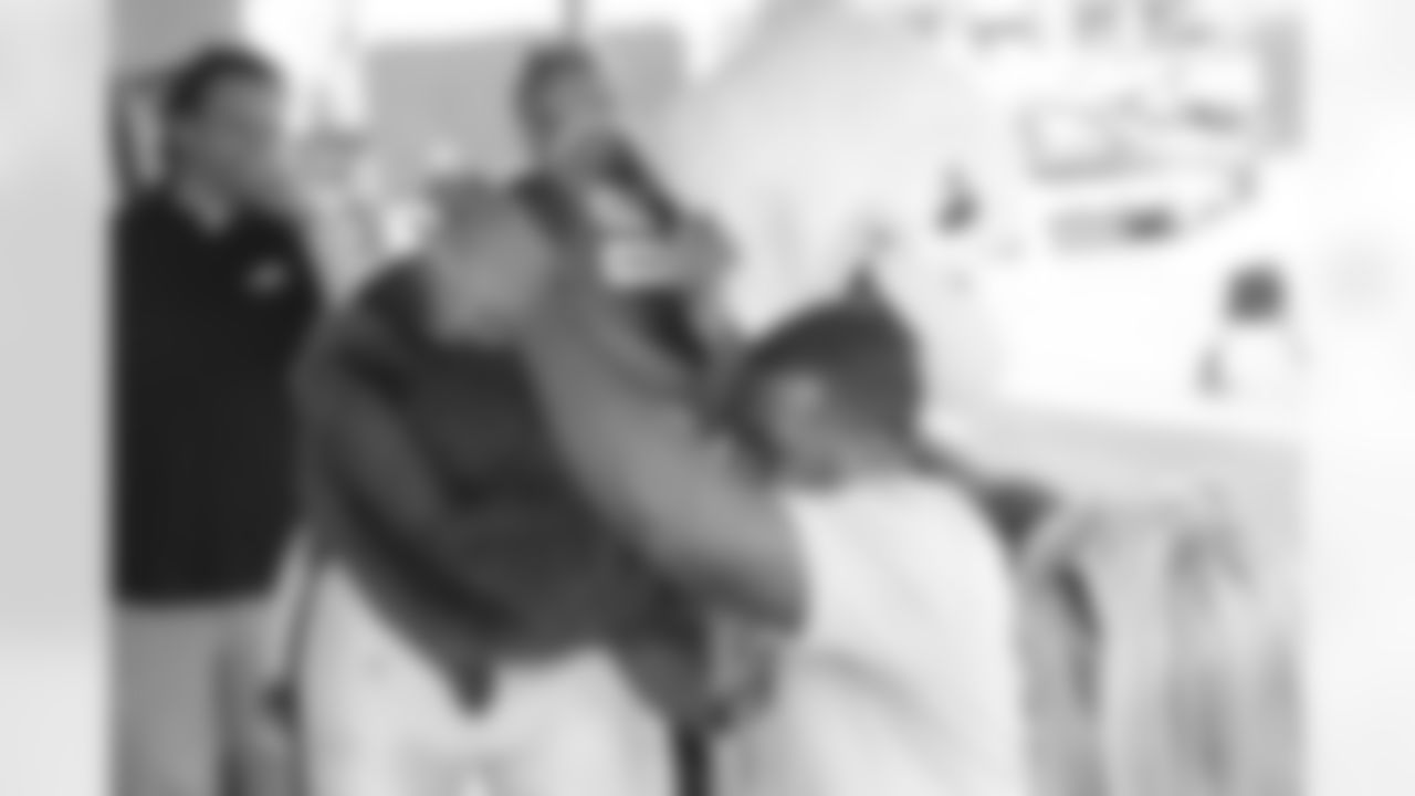 SWOOP gives Brandon Graham a big hug