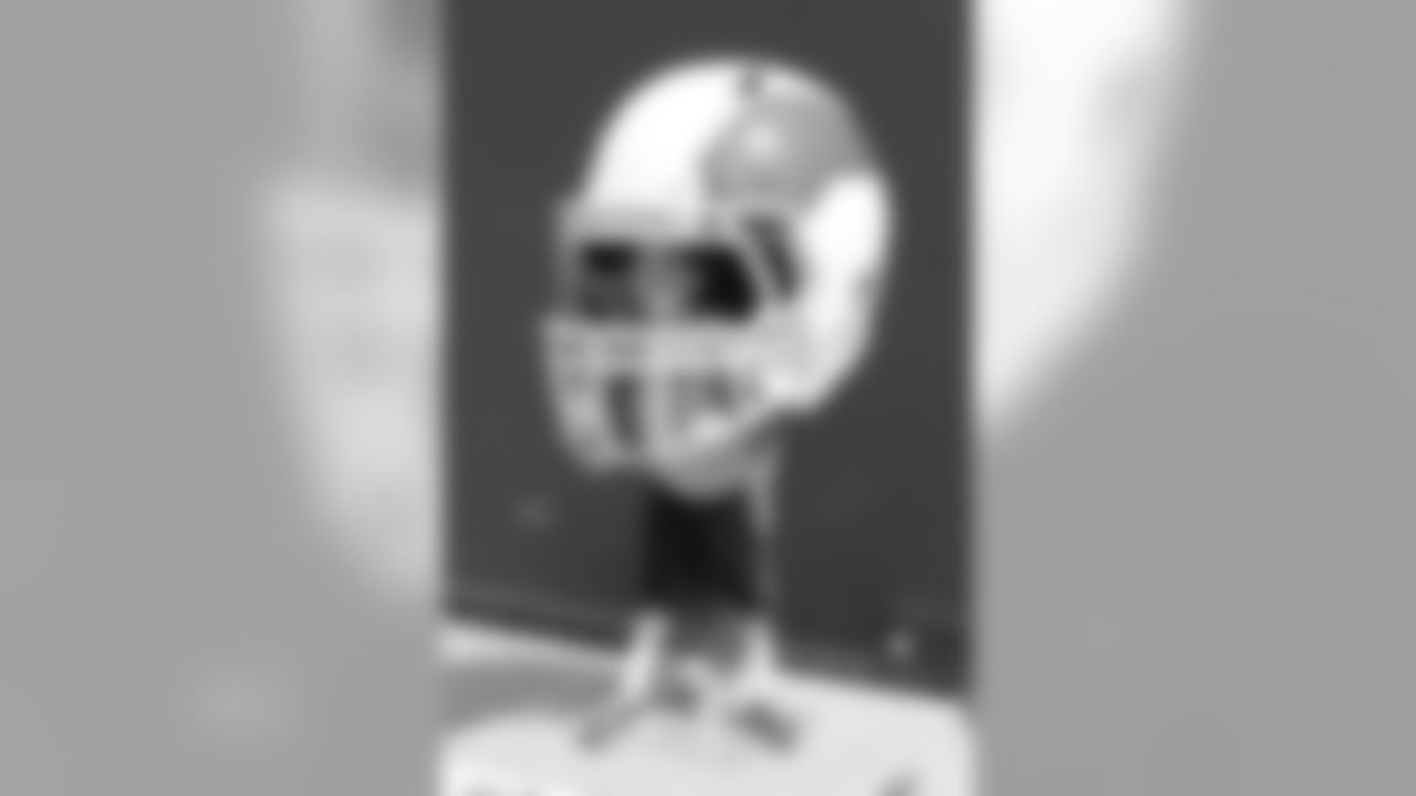 A fan inside a retro Eagles helmet.