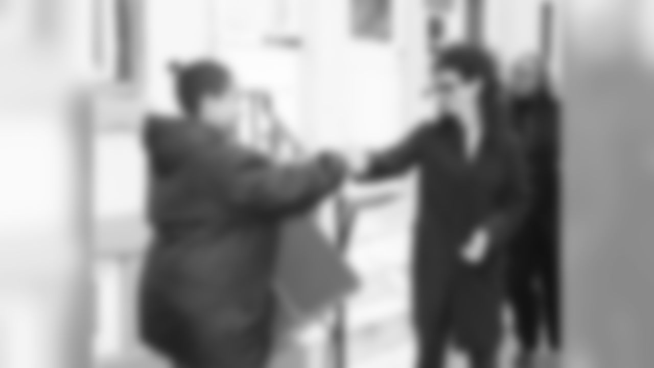 Christina Lurie greets a resident