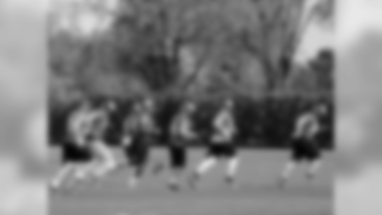 The offensive line changes fields for a team drill