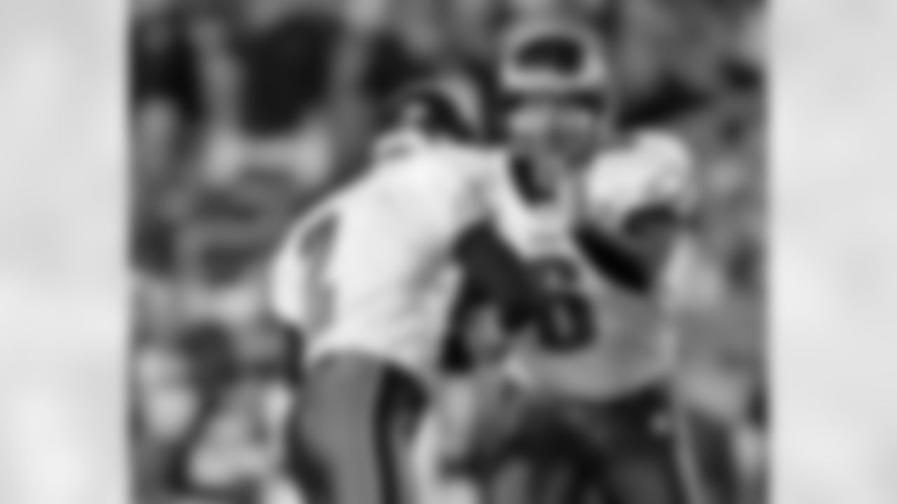 Holder Sav Rocca congratulates K David Akers following the FG