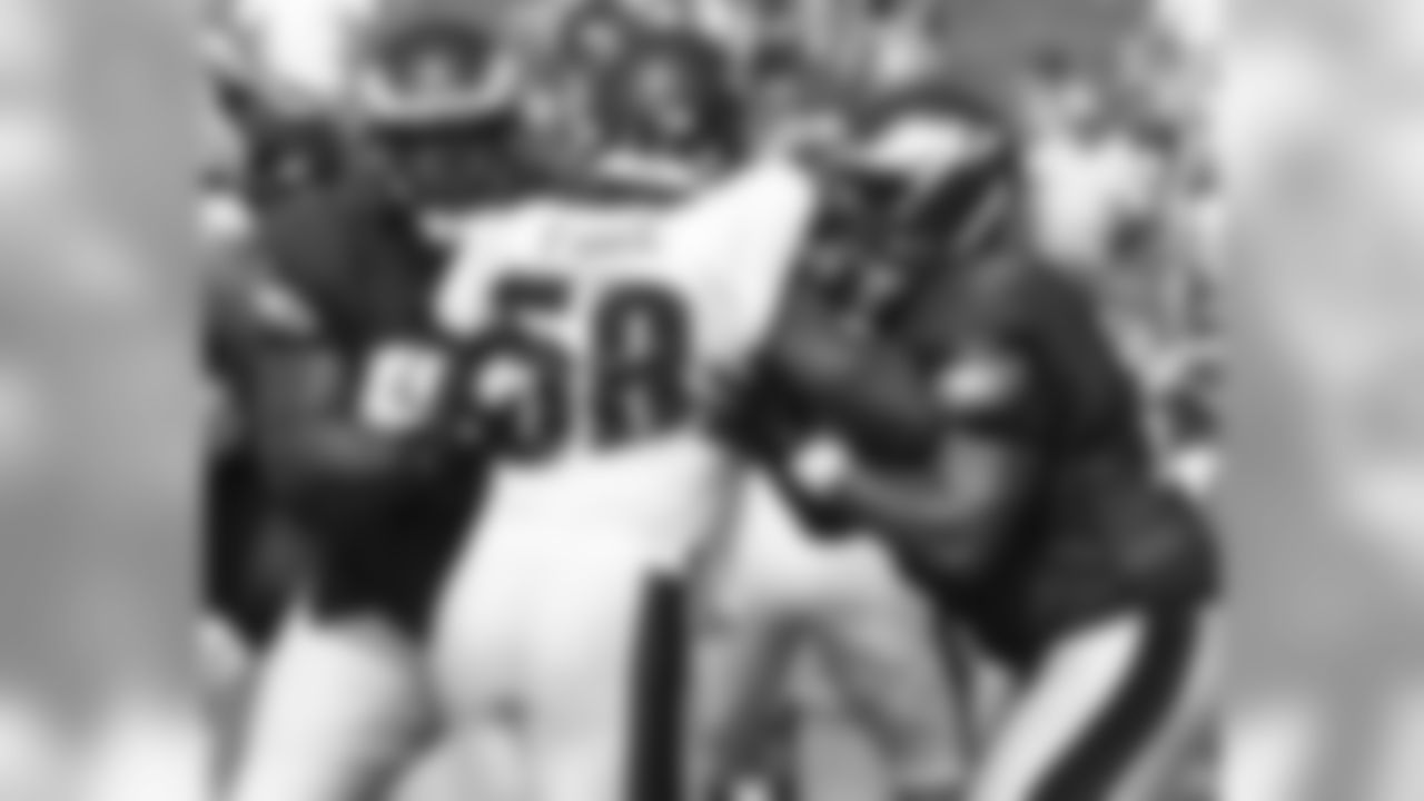 DE Trent Cole attempts to break through the double coverage