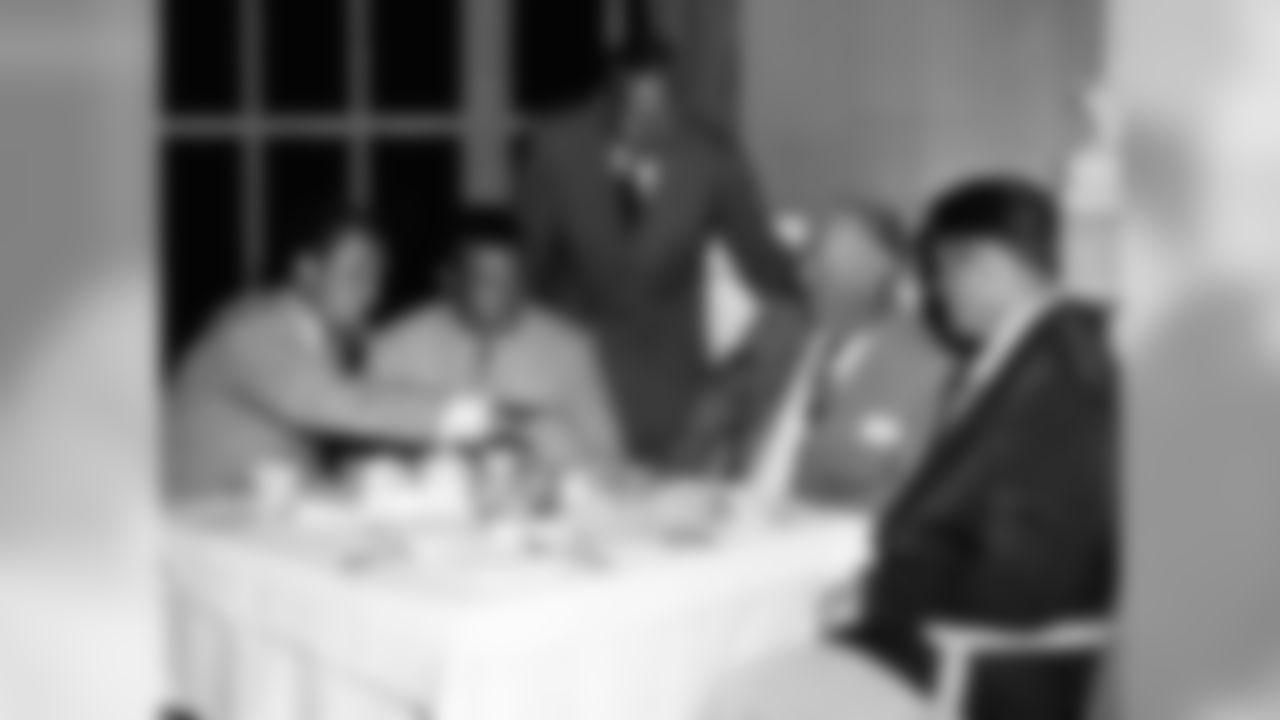 Al Wistert, standing, with QB Tommy Thompson, RB Steve Van Buren, Coach Greasy Neale and C Alex Wojciechowicz meet in Chicago in 1949 ahead of an exhibition game