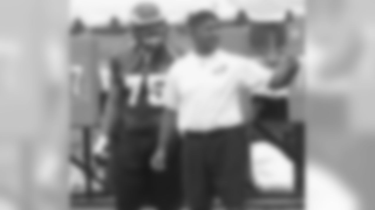 Offensive line coach Juan Castillo directs
