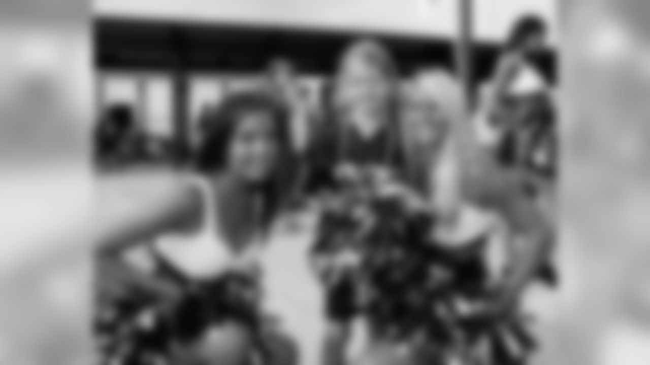 Cheerleaders Julia and Tiffany pose for a photo