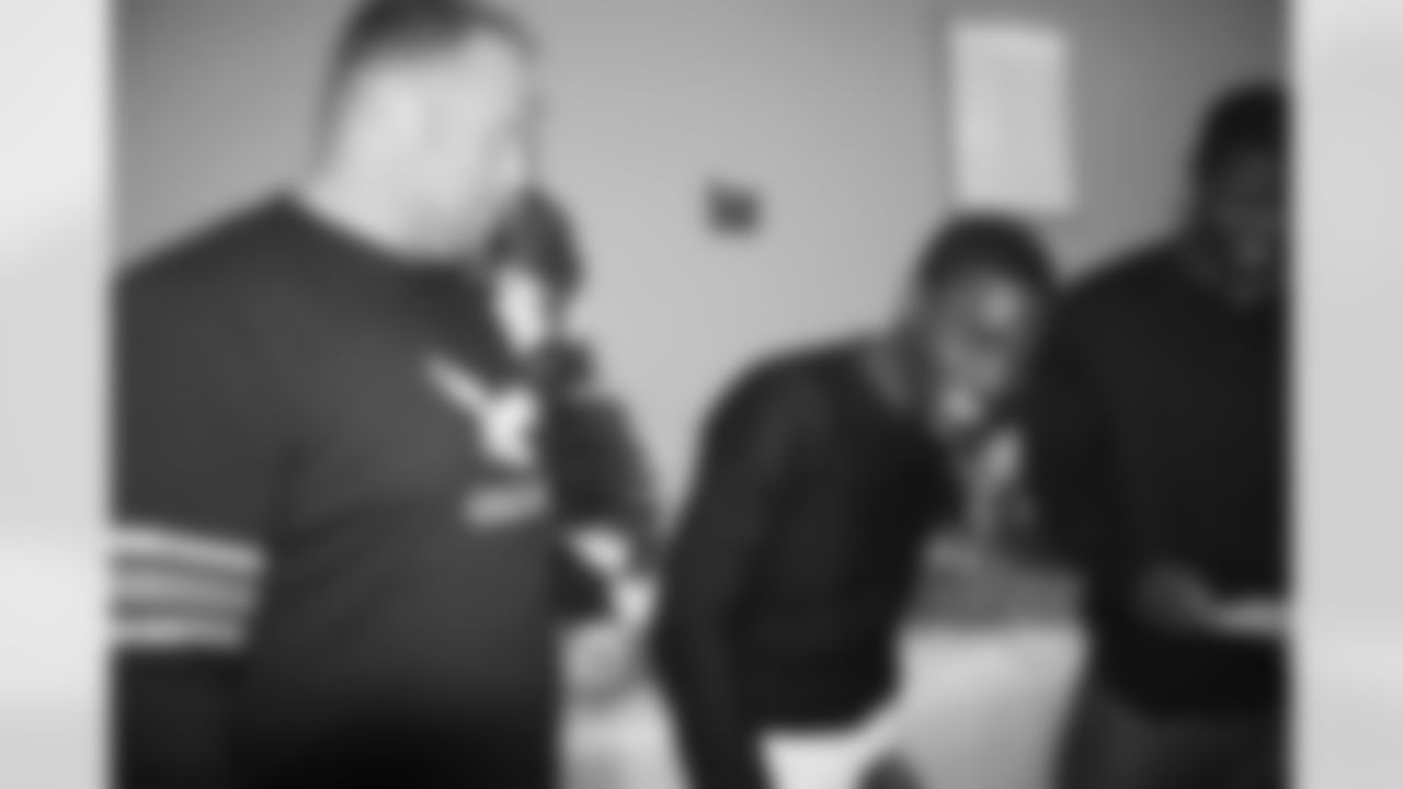 A.Q Shipley, #61 and a Covenant House member joking around