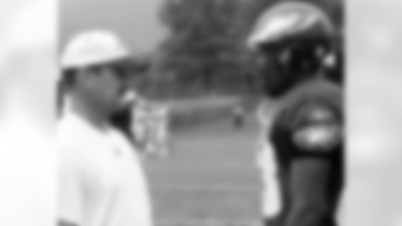 Offensive coordinator Brad Childress talks with WR Greg Lewis
