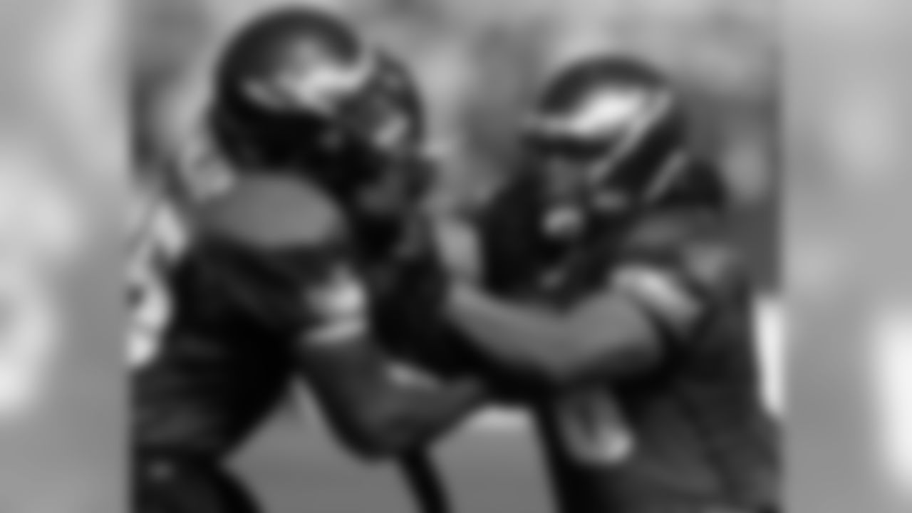 OLs King Dunlap and rookie Fenuki Tupou battle in a blocking drill