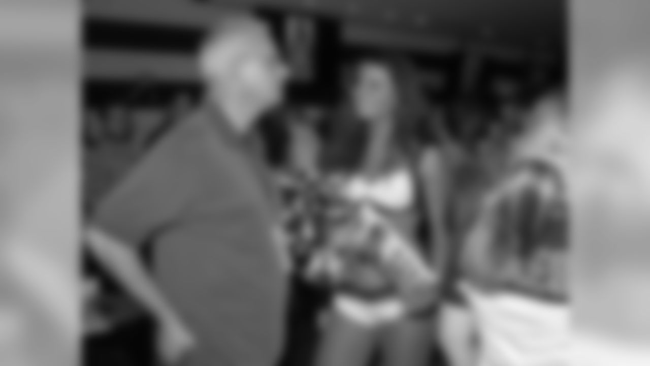 After the fashion show, Mandi talks to a guest in the Miller Lite VIP area