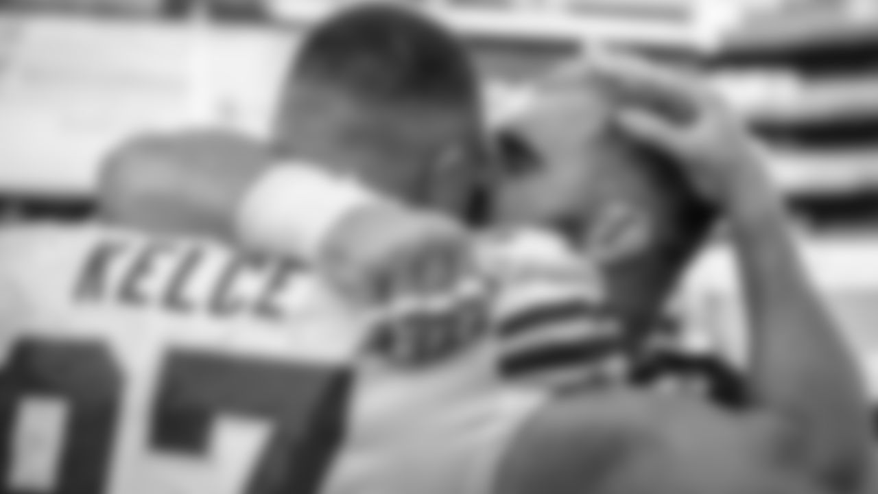 C Jason Kelce kissing his brother Travis Kelce