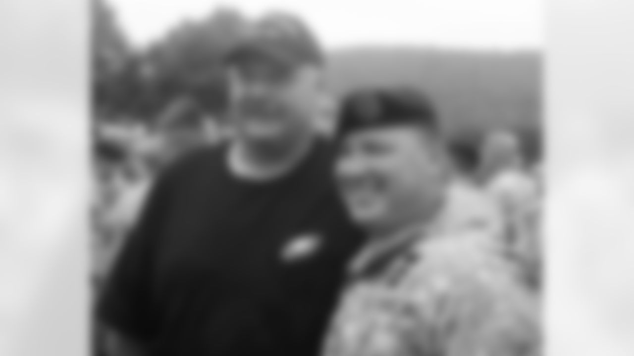 Head coach Andy Reid with a solider from the U.S. Army