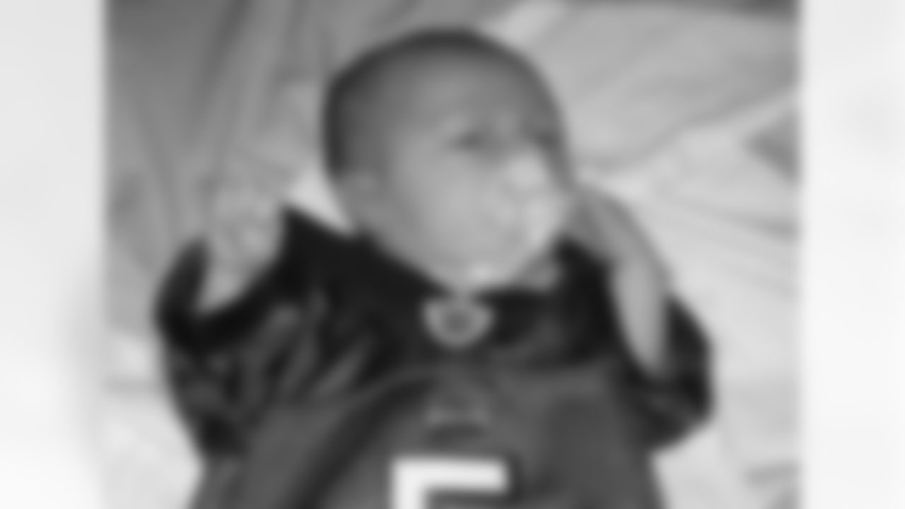 Colin wears his Donovan McNabb jersey proudly