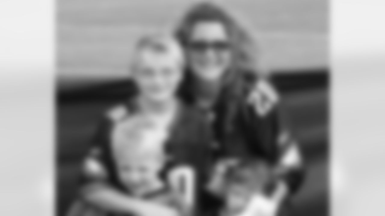 A mother and her children at Eagles practice