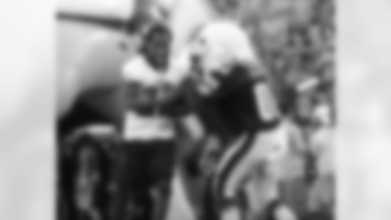 Asante Samuel trying to fight off a blocking Swoop