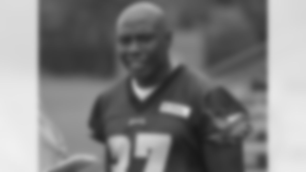 Newly signed RB Felix Jones answers questions following practice