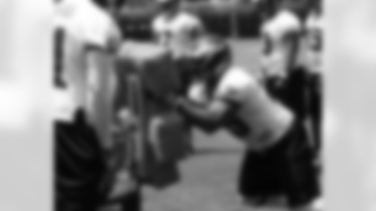 DE Juqua Parker works in defensive line drill