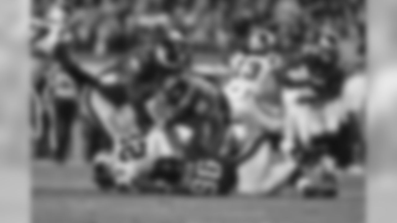 LB Connor Barwin and DT Bennie Logan work together to take down a Panthers player
