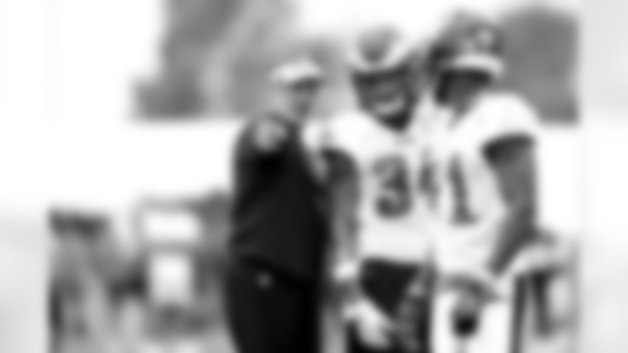 Defensive backs coach Cory Undlin talks to S Ryan Neal
