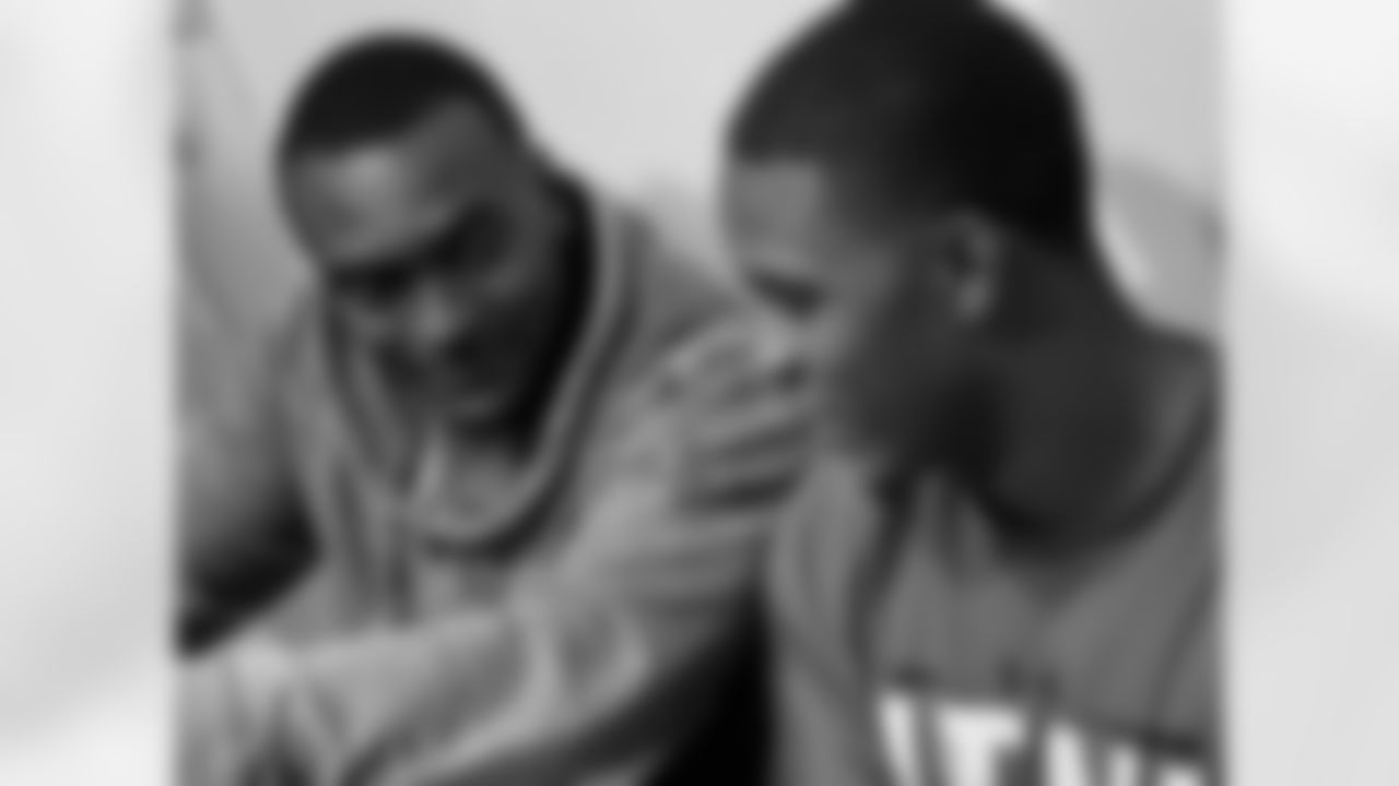 Defensive backs JaCorey Shepherd (left) and Eric Rowe chat while waiting to talk with the media