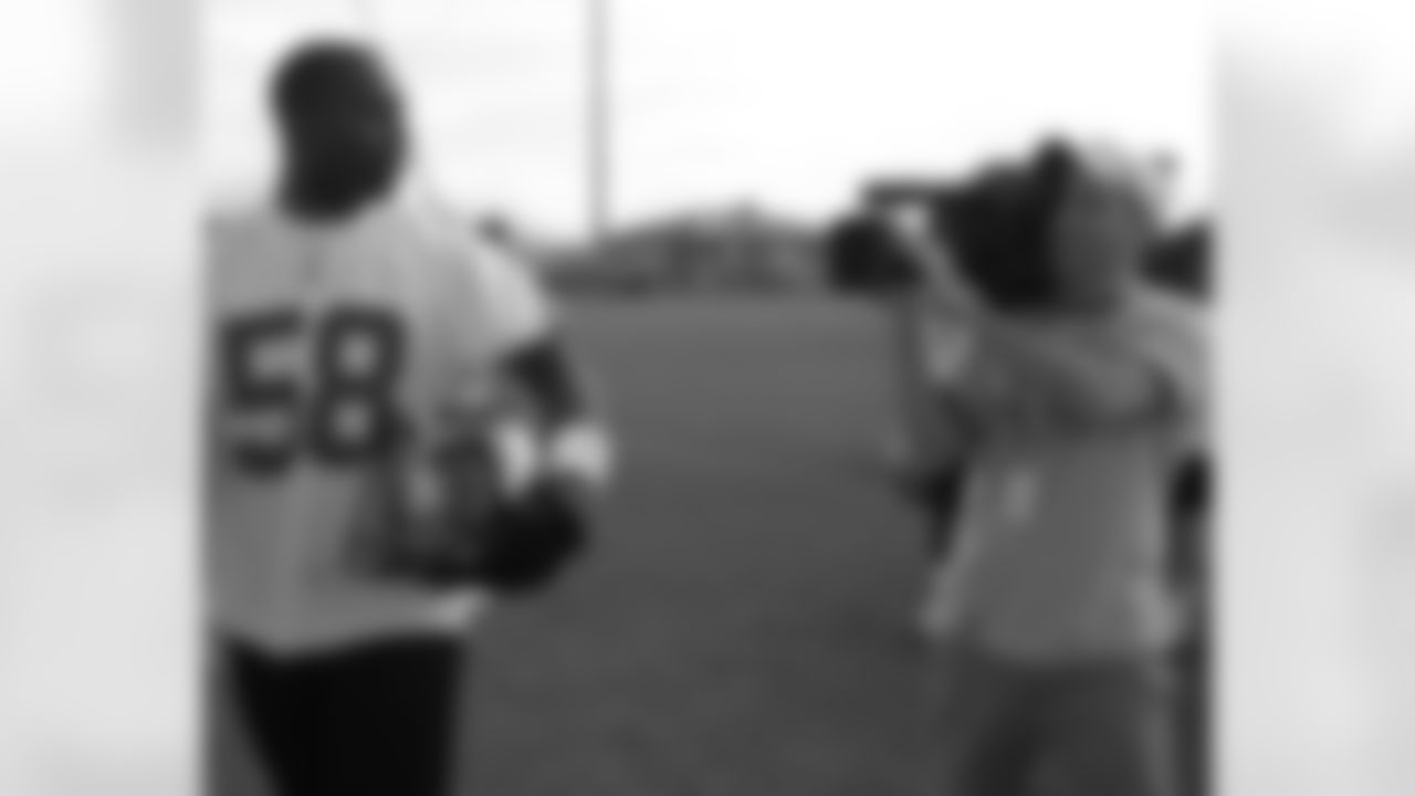 Rob Alberino from Eagles Television Network follows defensive end Trent Cole