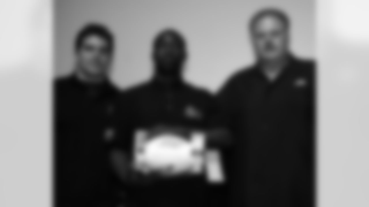 Simba Sellers of George Washington High School with Andy Reid and Kyle Eckel