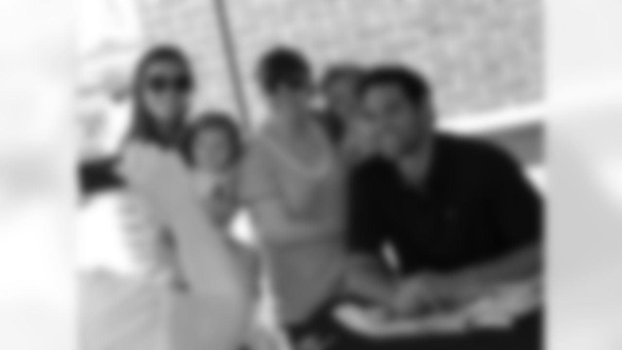 QB Mark Sanchez gets in this family photo