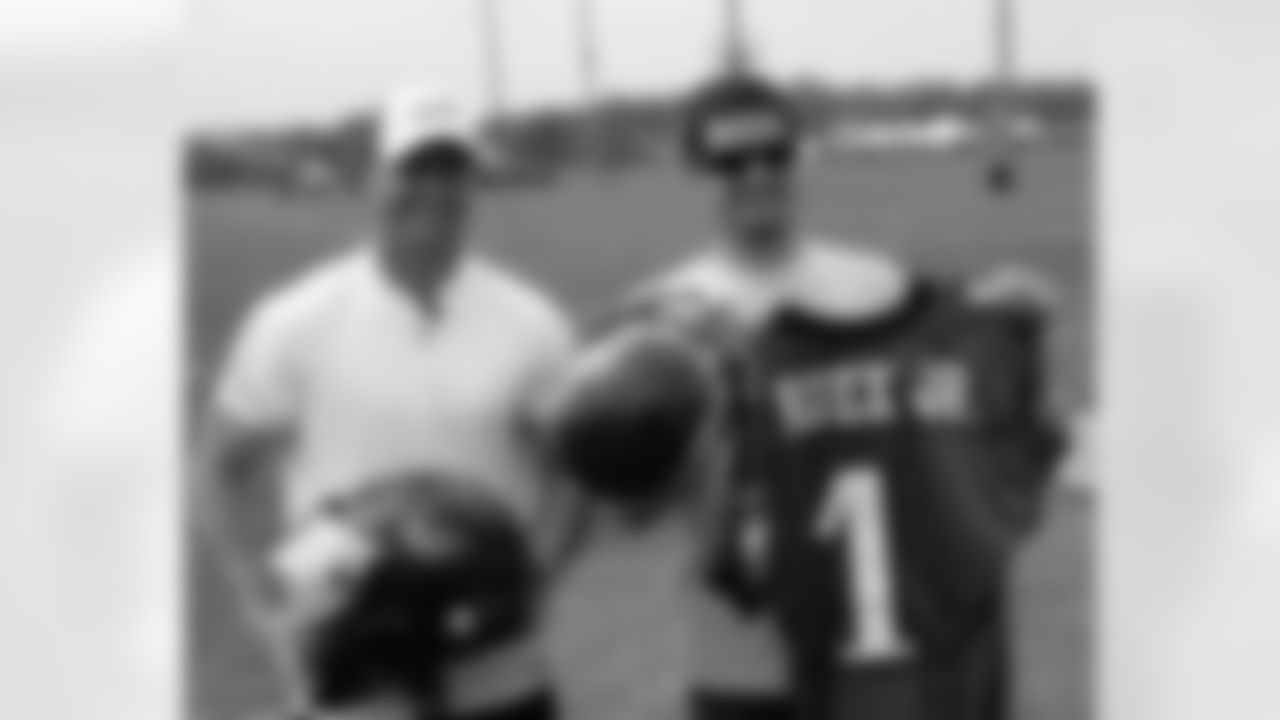 K David Akers and NASCAR driver Martin Truex Jr. swapped helmets Thursday, and Truex even scored his own personalized jersey