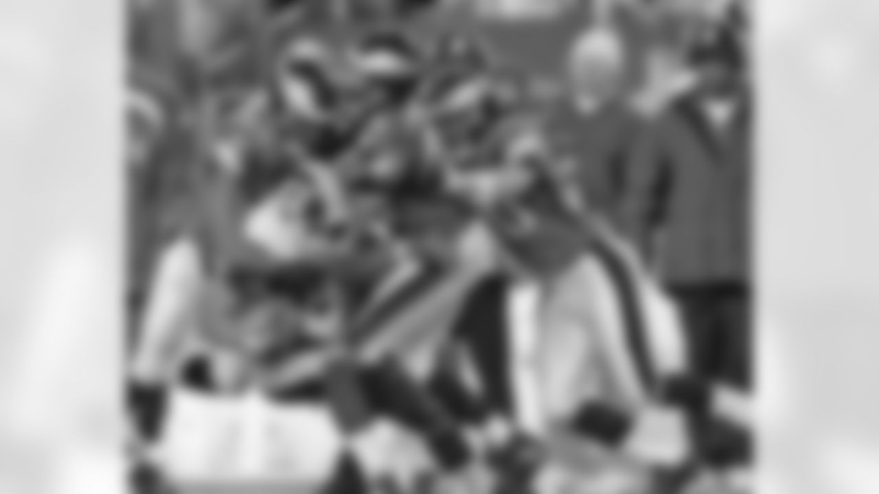 Redskins James Thrash is stopped on the return by Greg Lewis and company