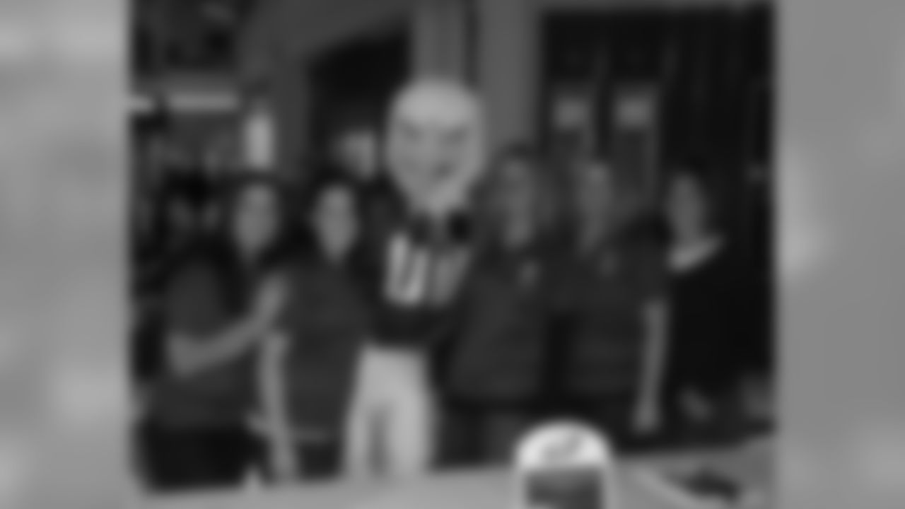 SWOOP with the women from Jefferson Hospitals. A portion of the proceeds from autograph ticket sales and Tackling Breast Cancer hats sales from the event benefited the Jefferson Breast Care Center