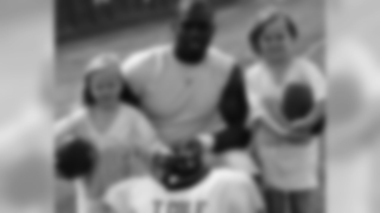 DE Trent Cole takes time for a photo op