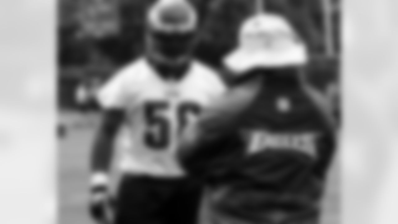 DE Trent Cole receives some instruction from defensive line coach Pete Jenkins