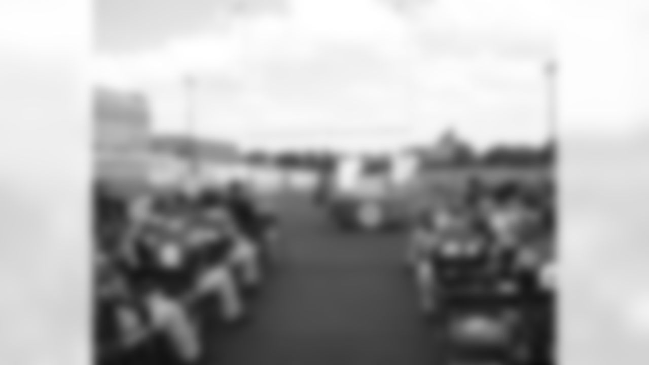 Father Joseph Esposito, principal of Monsignor Bonner HS, addresses the crowd gathered, which included members of the football team