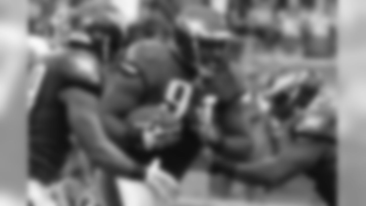 Eagles' DE Fletcher Cox runs after recovering the fumble.