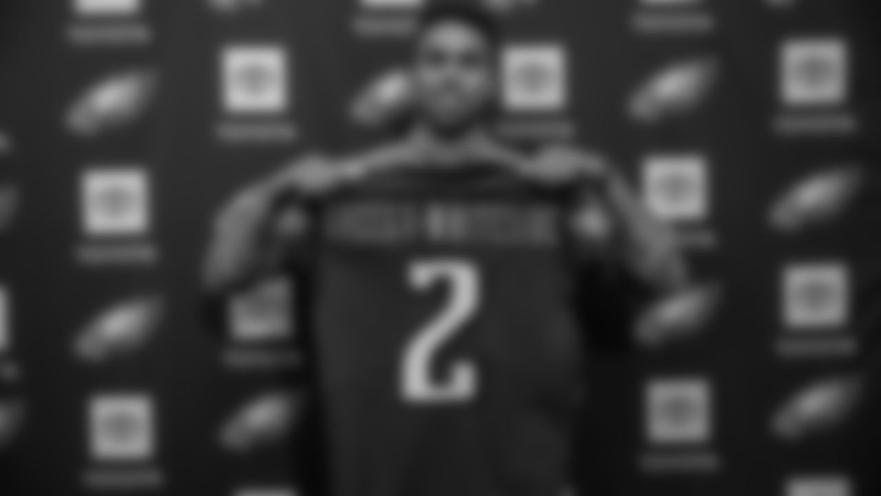 J.J. Arcega-Whiteside holds up a jersey at his introductory press conference