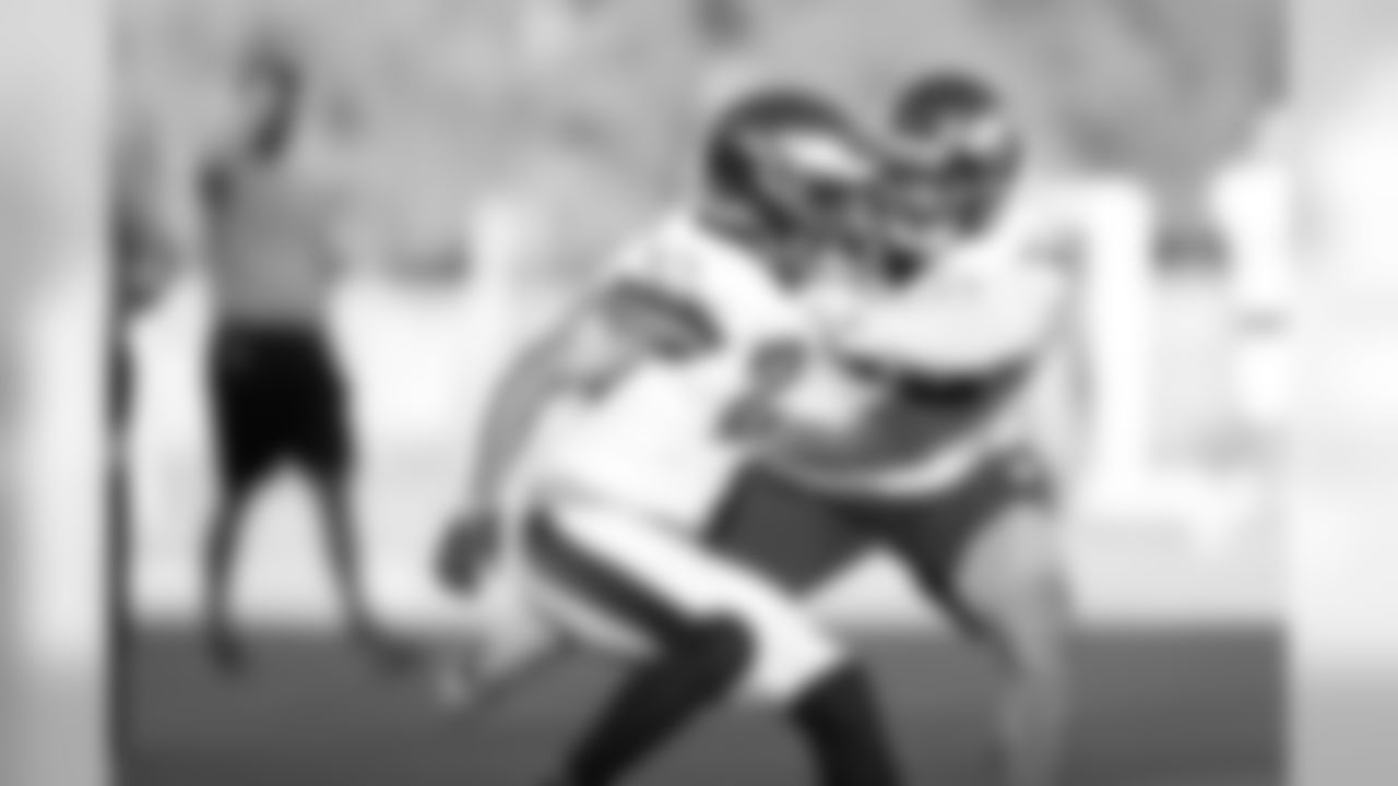 A pair of defensive backs battle it out.