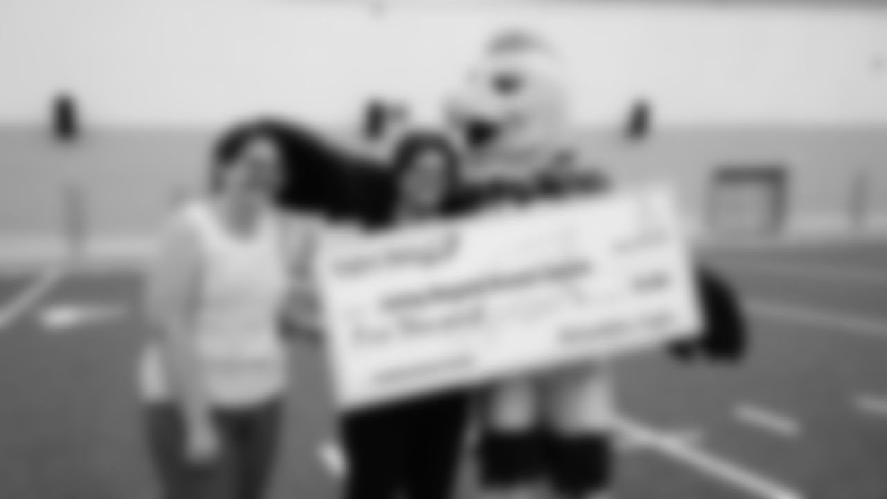 Once the yoga class was complete, the Eagles presented LBBC with a $5,000 check.