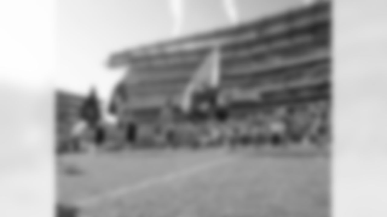 SWOOP, with his pink hat, leads the charge as the Eagles take the field