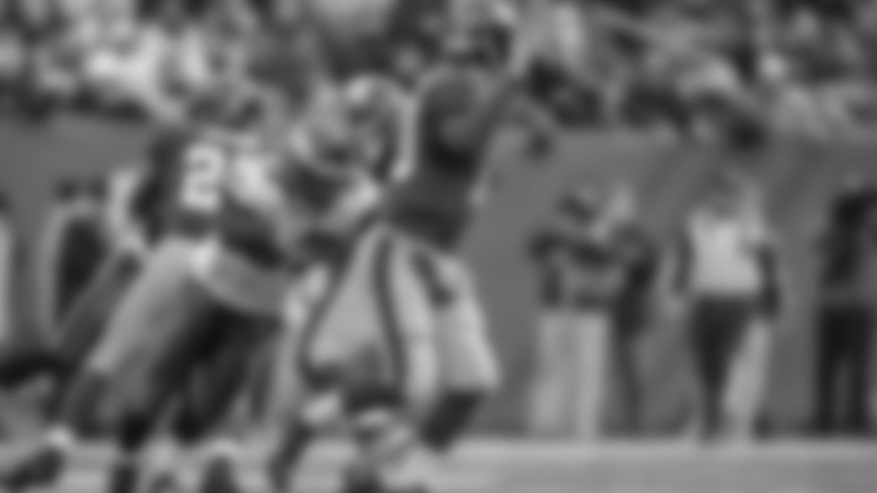LB Moise Fokou begins to corral QB Eli Manning