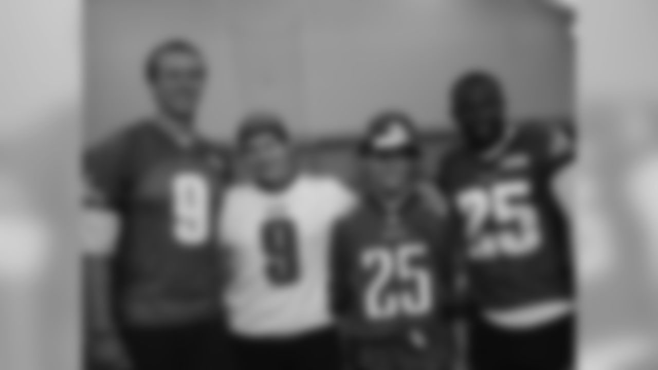 Colin takes a group photo with two of his favorite Eagles