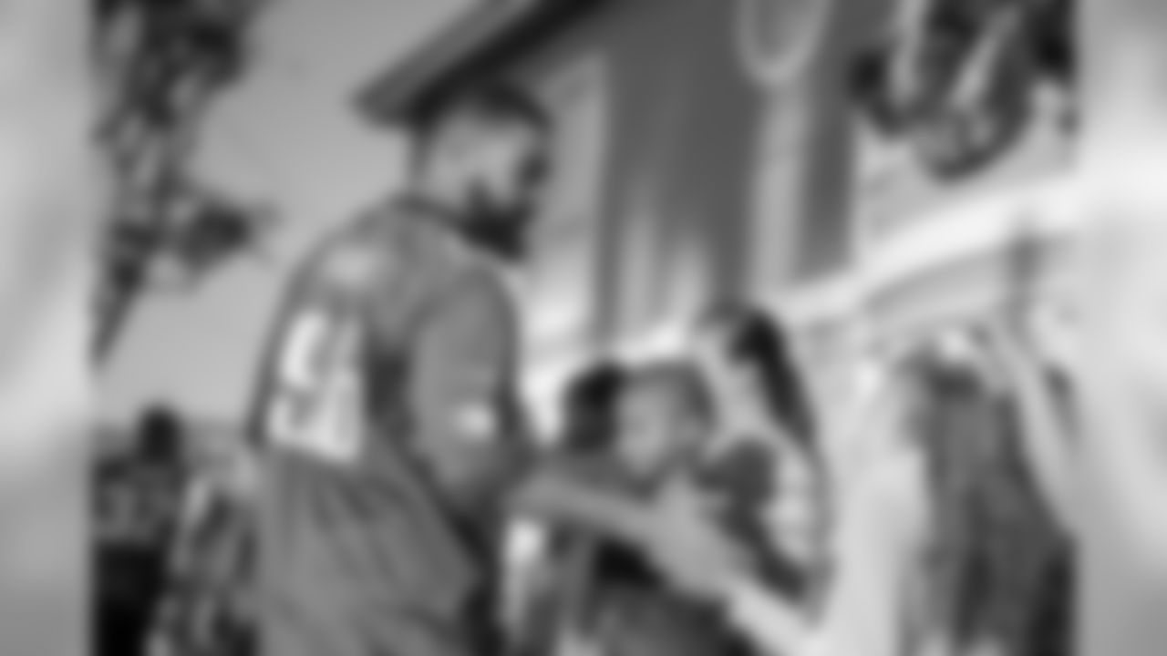 DE Derek Barnett greets children as he enters the Orange County Ronald McDonald House.