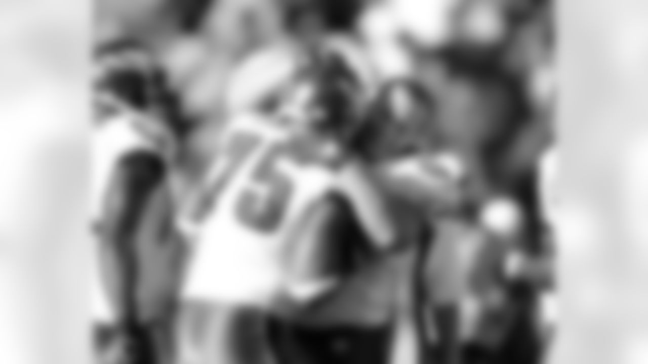 DE Juqua Parker gets a hug from DT-turned-FB Dan Klecko