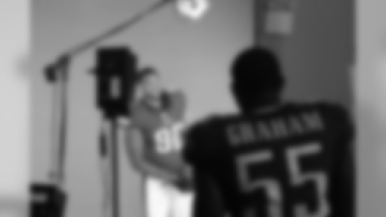 Marcus Smith II takes his turn with Brandon Graham looking on