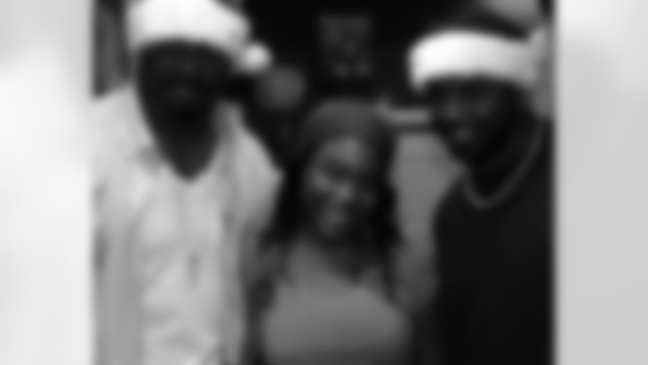 Brian Dawkins and Brian Westbrook handed out holiday gifts Wednesday at the Children's Hospital of Philadelphia