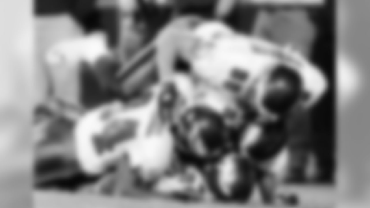 RB Brian Westbrook receives a celebratory tackle from his teammates